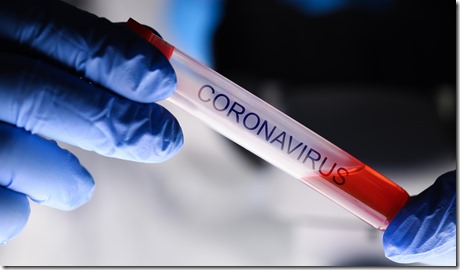 Male chemist hand in blue protective gloves hold test tube closeup background