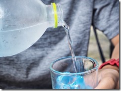 Pouring water into glass