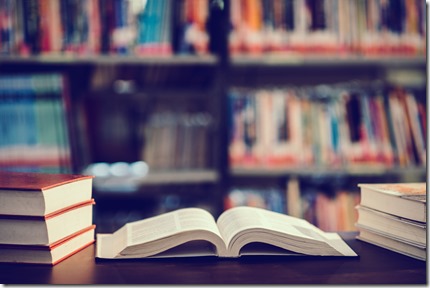 Book in library with open textbook,education learning concept