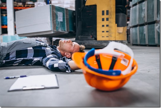 An accident at a warehouse, man on floor