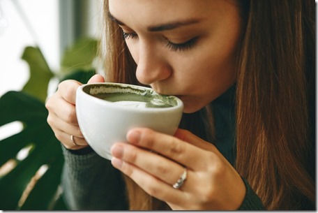 Girl drinks matcha latte tea