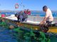 Pescadores artesanales en caleta Tongoy revisando sus embarcaciones dañadas por los temporales.