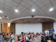 Grupo de personas mayores participando activamente en un taller informativo sobre derechos humanos en Antofagasta.